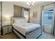 Bedroom with a queen-size bed and light wood frame at 6047 Broad Oak Dr, Davenport, FL 33837