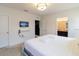 Bedroom with mounted TV and en-suite bathroom at 6047 Broad Oak Dr, Davenport, FL 33837