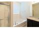 Bathroom with soaking tub, shower, and granite countertops at 6047 Broad Oak Dr, Davenport, FL 33837