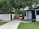 Newly painted garage and house with side yard at 1639 Silver Star Rd, Orlando, FL 32804