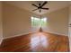 Bedroom with hardwood floors and ceiling fan at 1639 Silver Star Rd, Orlando, FL 32804