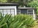 Side view of a white house with black trim at 1639 Silver Star Rd, Orlando, FL 32804