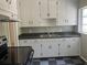 Kitchen with white cabinets, granite counters, and black appliances at 1639 Silver Star Rd, Orlando, FL 32804