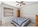 Well-lit bedroom with a ceiling fan and built-in shelving at 1013 Nin St, Orlando, FL 32835