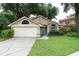 Charming one-story house with a well-maintained lawn at 1013 Nin St, Orlando, FL 32835