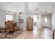 Charming dining area with a glass-top table and kitchen access at 1013 Nin St, Orlando, FL 32835