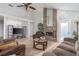 Spacious living room, featuring hardwood floors and a brick fireplace at 1013 Nin St, Orlando, FL 32835