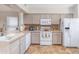 Bright kitchen with ample counter space, updated appliances, and tile flooring at 1013 Nin St, Orlando, FL 32835