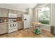 Well-equipped kitchen with white appliances and wood cabinets at 1013 Nin St, Orlando, FL 32835