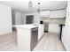 Modern kitchen with stainless steel appliances and white shaker cabinets at 2070 W Airport Blvd, Sanford, FL 32771