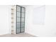 Built-in closet with sliding glass doors and shelving at 2070 W Airport Blvd, Sanford, FL 32771