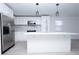 Modern kitchen with white cabinets, stainless steel appliances & an island at 2070 W Airport Blvd, Sanford, FL 32771