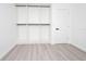 White closet with hanging rods and shelves in bedroom at 2070 W Airport Blvd, Sanford, FL 32771