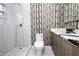 Updated bathroom with a walk-in shower and stylish tile at 2070 W Airport Blvd, Sanford, FL 32771