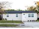 Newly renovated single story home with a modern exterior and landscaped yard at 2070 W Airport Blvd, Sanford, FL 32771