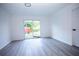 Bright bedroom with sliding glass doors to backyard at 2070 W Airport Blvd, Sanford, FL 32771