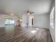 Bright and spacious living room with wood-look flooring at 7609 Rose Ave, Orlando, FL 32810