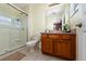 Bathroom with walk-in shower and wood vanity at 4527 Alberto Cir, Kissimmee, FL 34746