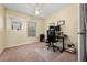 Bright home office features window, desk, and carpeted floors at 4527 Alberto Cir, Kissimmee, FL 34746