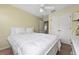 Bedroom with double bed, ceiling fan, and double door closet at 4527 Alberto Cir, Kissimmee, FL 34746
