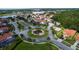 Aerial view of Bella Vida community, showcasing homes, landscaping, and a central roundabout at 4527 Alberto Cir, Kissimmee, FL 34746