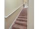 Carpeted staircase with neutral wall colors at 4527 Alberto Cir, Kissimmee, FL 34746