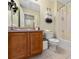Clean bathroom with shower/tub combo and wood vanity at 4527 Alberto Cir, Kissimmee, FL 34746