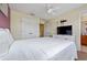 Main bedroom with white bedding and en-suite access at 4527 Alberto Cir, Kissimmee, FL 34746