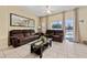 Living room boasts a comfortable leather sofa and glass coffee table at 4527 Alberto Cir, Kissimmee, FL 34746