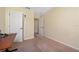 Spacious bedroom with carpeted floors and access to hallway at 4527 Alberto Cir, Kissimmee, FL 34746