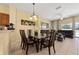 Bright dining area with glass table and seating for six at 4527 Alberto Cir, Kissimmee, FL 34746