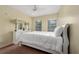Bedroom with white dresser, mirror, and comfortable bed at 4527 Alberto Cir, Kissimmee, FL 34746