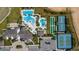 Aerial view of community with pools, tennis courts, and parking at 2132 Antilles Club Dr, Kissimmee, FL 34747