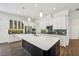 Modern kitchen with white cabinets, large island, and stainless steel appliances at 2132 Antilles Club Dr, Kissimmee, FL 34747