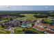 Aerial view of community with pools, tennis courts, and homes at 2132 Antilles Club Dr, Kissimmee, FL 34747