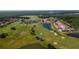 Aerial view of community with golf course, lake, and residential areas at 2132 Antilles Club Dr, Kissimmee, FL 34747