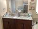 Bathroom boasting double sinks, granite countertop, and a modern aesthetic at 514 Tree Shore Dr, Orlando, FL 32825