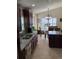 Updated kitchen with granite countertops and stainless steel appliances at 514 Tree Shore Dr, Orlando, FL 32825