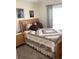 Bright bedroom featuring a queen-size bed and wood furniture at 514 Tree Shore Dr, Orlando, FL 32825