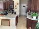 Modern kitchen with granite countertops and dark wood cabinets at 514 Tree Shore Dr, Orlando, FL 32825