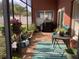 Relaxing screened porch with patio furniture and potted plants at 514 Tree Shore Dr, Orlando, FL 32825