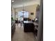 Spacious kitchen with an island, dark wood cabinets, and stainless steel appliances at 514 Tree Shore Dr, Orlando, FL 32825