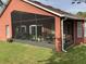 House exterior with a large screened porch and lawn at 514 Tree Shore Dr, Orlando, FL 32825