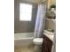 Clean bathroom with a shower/tub combo, single vanity and neutral color scheme at 514 Tree Shore Dr, Orlando, FL 32825