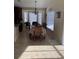Bright dining room with large table and bay window at 514 Tree Shore Dr, Orlando, FL 32825