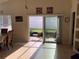 Bright dining area with access to the backyard through sliding doors at 514 Tree Shore Dr, Orlando, FL 32825
