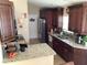 Modern kitchen with granite counters and dark wood cabinets at 514 Tree Shore Dr, Orlando, FL 32825