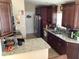 Modern kitchen with granite counters and dark wood cabinets at 514 Tree Shore Dr, Orlando, FL 32825