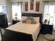 Well-lit bedroom featuring a comfortable double bed and dark wood furniture at 514 Tree Shore Dr, Orlando, FL 32825