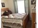Charming bedroom with a full-size bed and decorative quilt at 514 Tree Shore Dr, Orlando, FL 32825